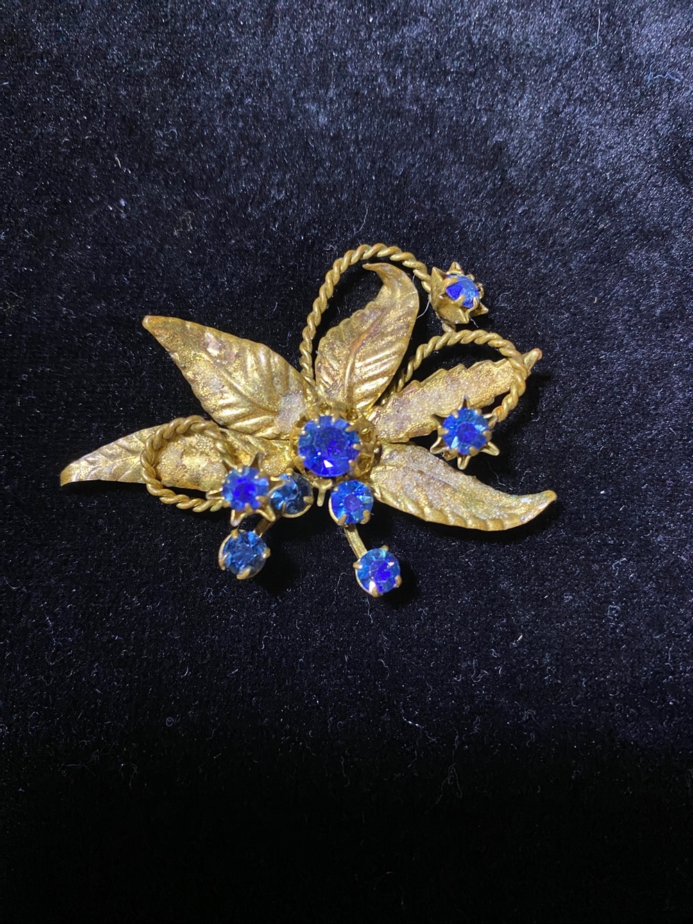 Vintage Austria Stamped Blue Sapphire Aurora B Crystal Gold tone Flower Brooch